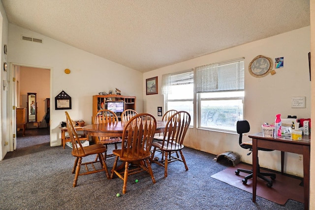 3363 S Anchor Ave, Orange Cove, CA 93646 - dining area with a textured ceiling, dark colored carpet, and lofted ceiling