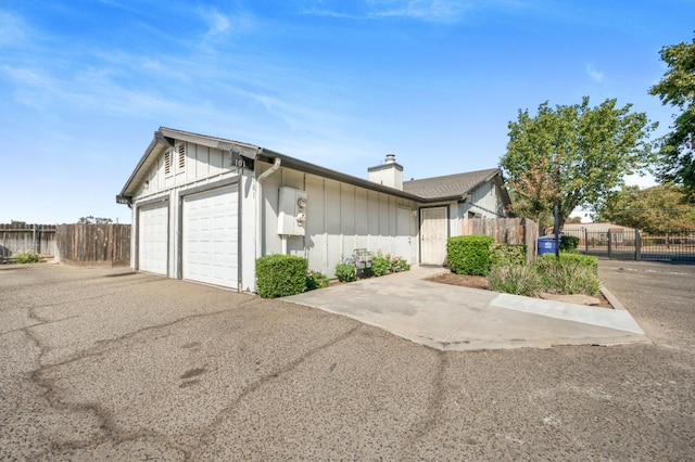 ranch-style home featuring a garage