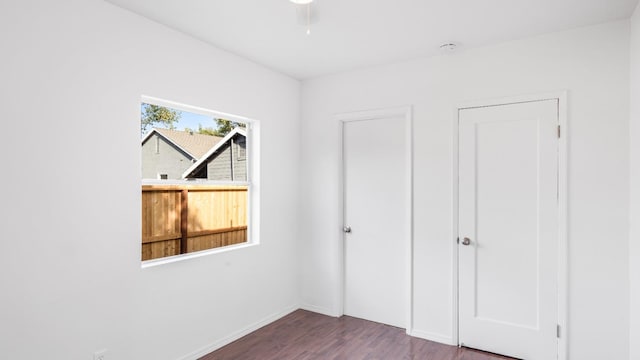 unfurnished bedroom with hardwood / wood-style floors and ceiling fan