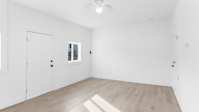 unfurnished room with ceiling fan and light hardwood / wood-style floors