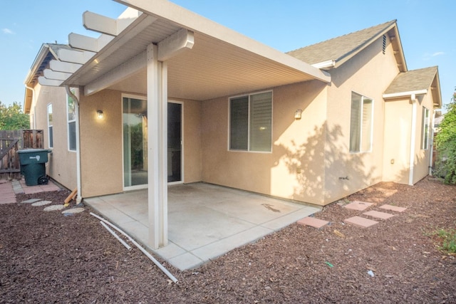 rear view of property featuring a patio area