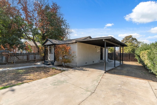 exterior space featuring a carport