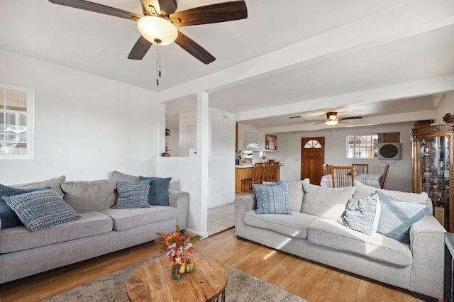 living room with hardwood / wood-style floors and ceiling fan