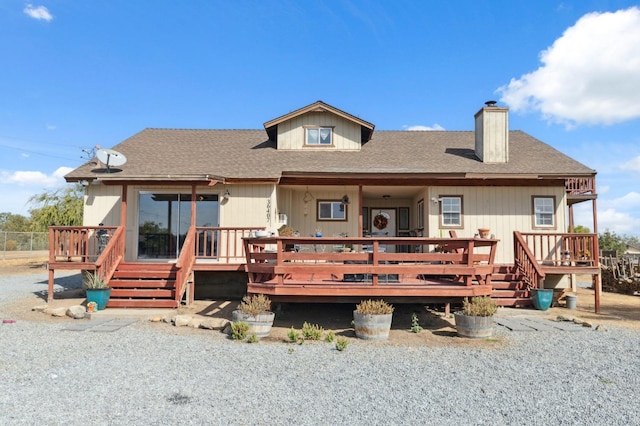 back of property with a wooden deck