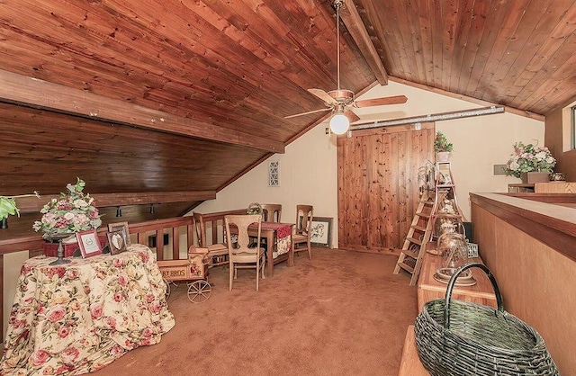 interior space with ceiling fan, wooden ceiling, a barn door, vaulted ceiling with beams, and light colored carpet