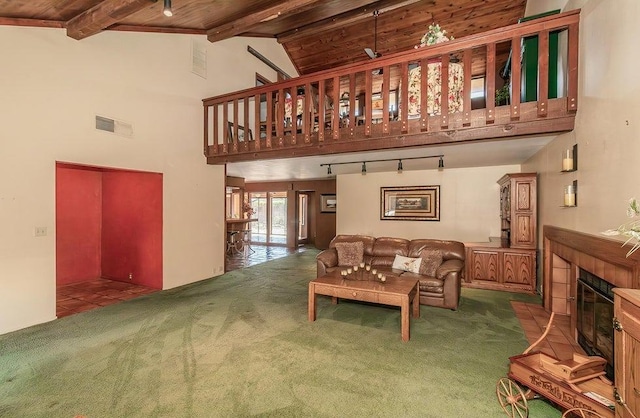 living room featuring high vaulted ceiling, beam ceiling, wooden ceiling, and carpet flooring