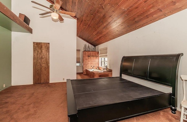 bedroom with ceiling fan, wood ceiling, high vaulted ceiling, and light carpet