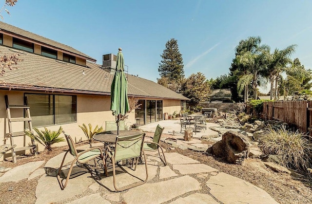 1531 E Avila, Tulare, CA 93274 - view of patio with fence and outdoor dining area