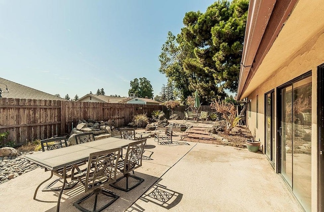 1531 E Avila, Tulare, CA 93274 - view of patio / terrace with a fenced backyard and outdoor dining space