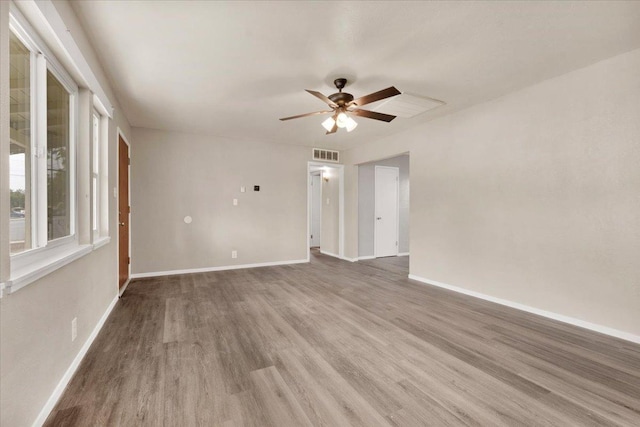 spare room featuring ceiling fan and wood-type flooring