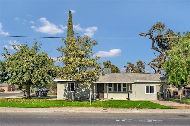 ranch-style house with a front yard