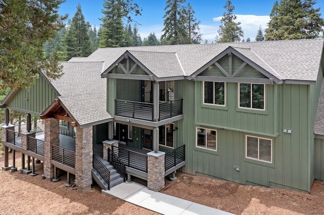 view of front of property with a wooden deck and a balcony