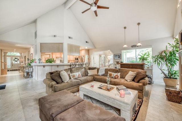 living area featuring visible vents, a ceiling fan, beam ceiling, high vaulted ceiling, and light tile patterned flooring