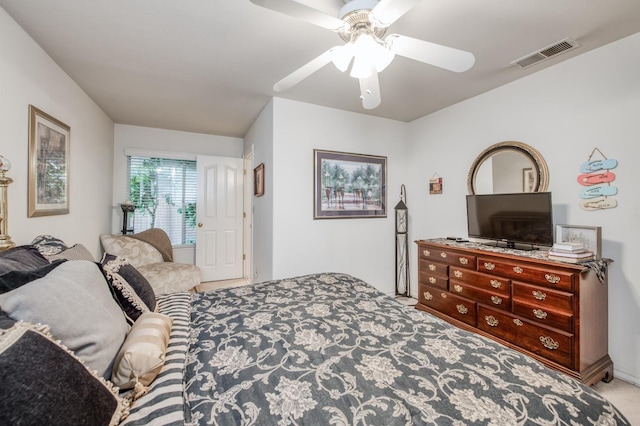 bedroom with carpet flooring, visible vents, and a ceiling fan