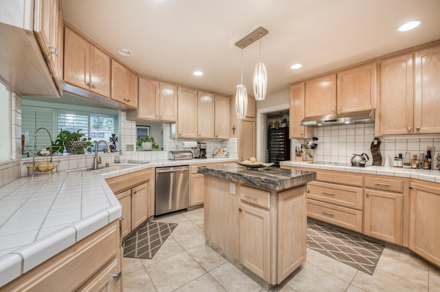 kitchen featuring under cabinet range hood, dishwasher, and light brown cabinets