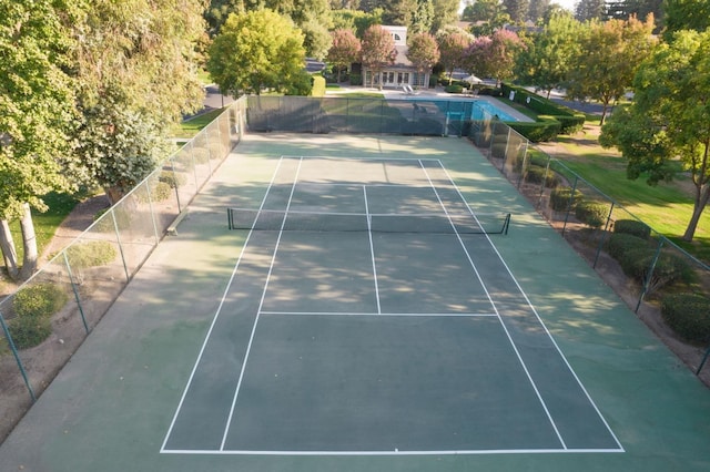 view of sport court with fence