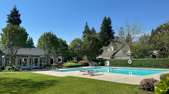 view of pool with a fenced in pool, a patio, french doors, a yard, and fence