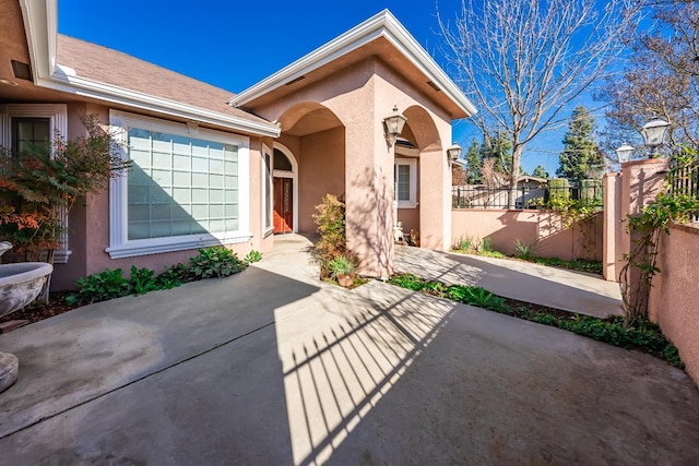 entrance to property with a patio