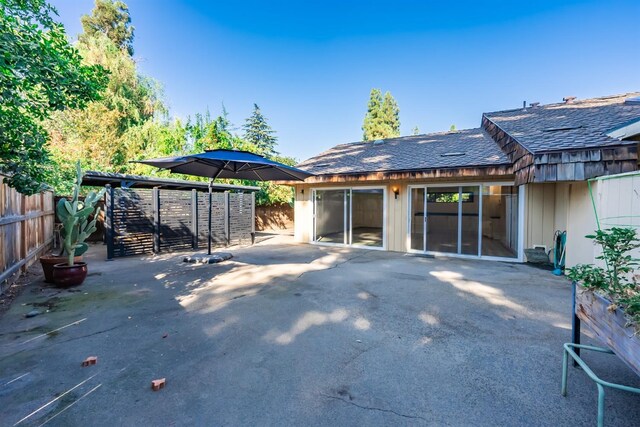 back of house featuring fence and a patio area