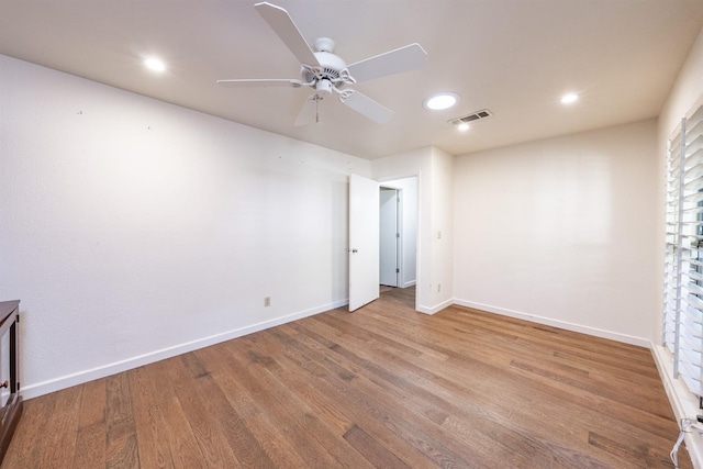 unfurnished bedroom with ceiling fan and light hardwood / wood-style floors