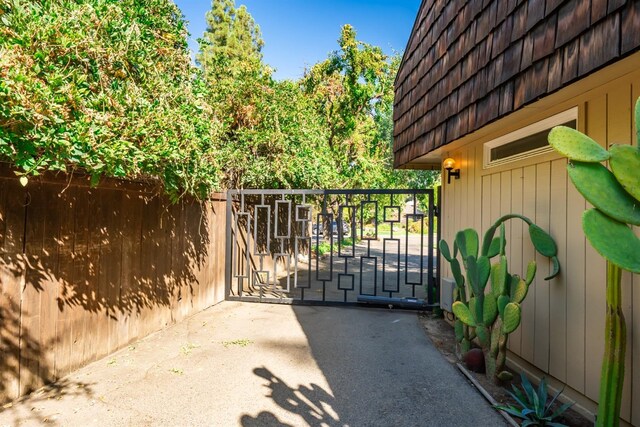view of gate with fence