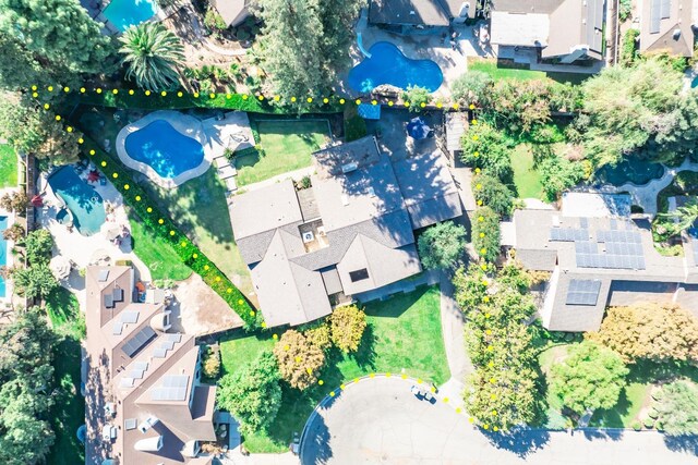 birds eye view of property with a residential view