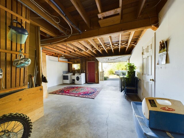 interior space with concrete floors and separate washer and dryer