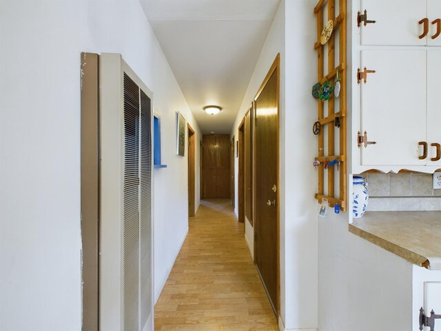 hallway with light wood-type flooring