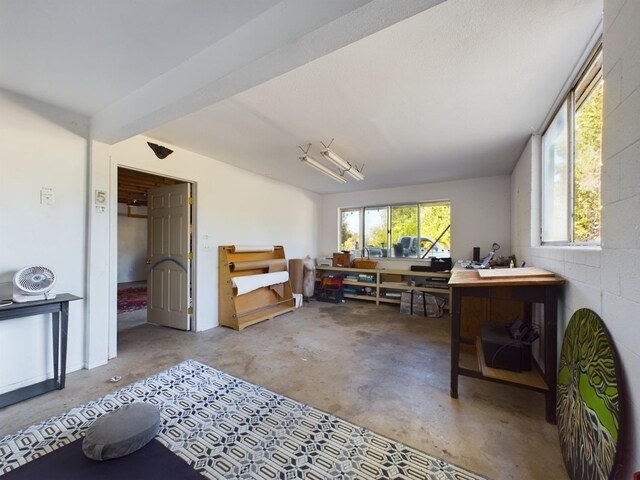 misc room with concrete flooring