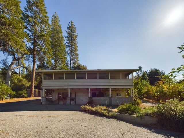 view of front of property with a sunroom