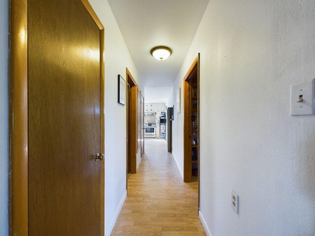 corridor featuring light hardwood / wood-style flooring