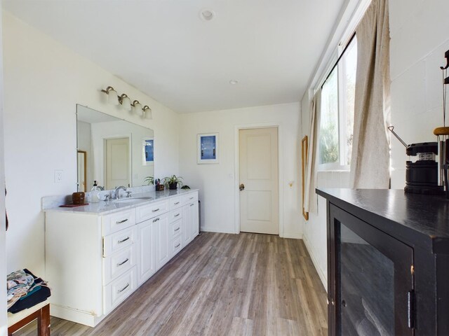 bathroom with vanity and hardwood / wood-style floors