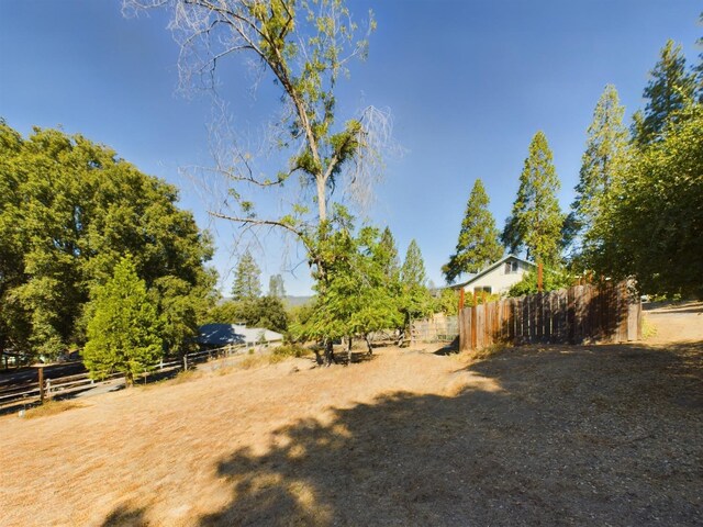 view of yard with a rural view