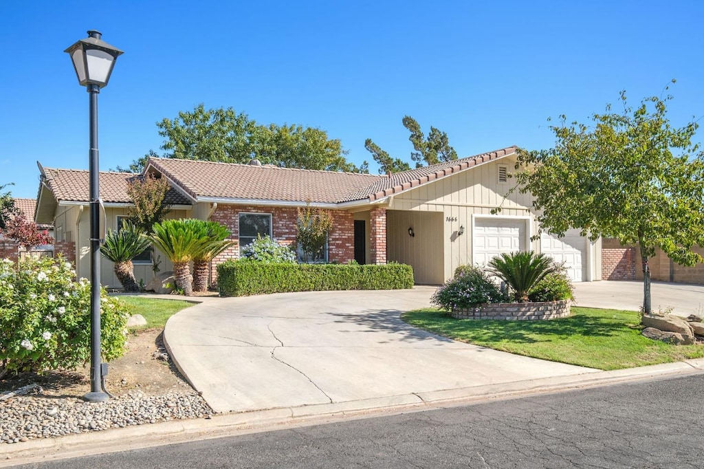 ranch-style house featuring a garage