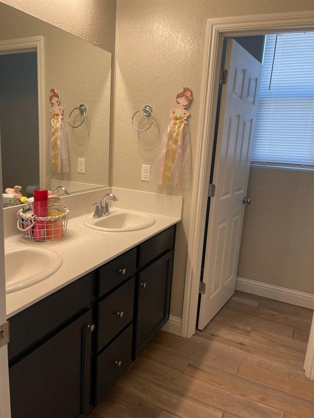 bathroom with vanity and hardwood / wood-style floors