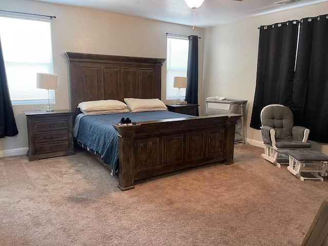 carpeted bedroom featuring ceiling fan