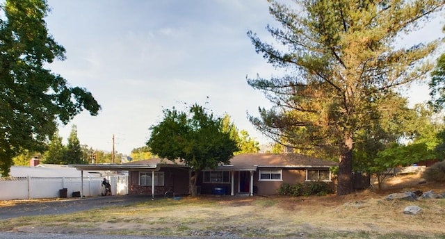 ranch-style home with a carport