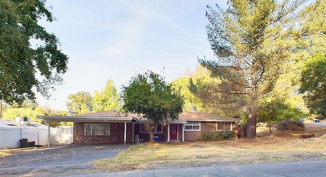 ranch-style house with a carport