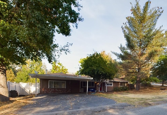 single story home with a carport