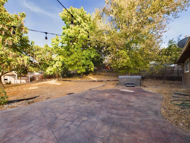 view of patio / terrace featuring a hot tub