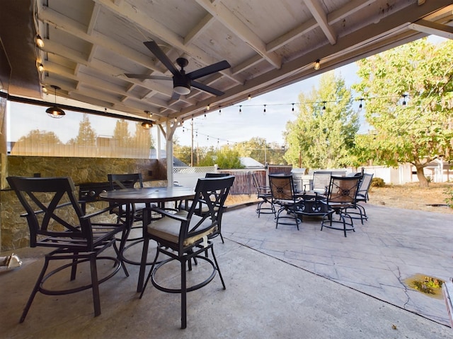 view of patio featuring ceiling fan