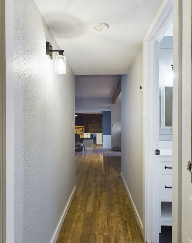 hall with dark hardwood / wood-style floors