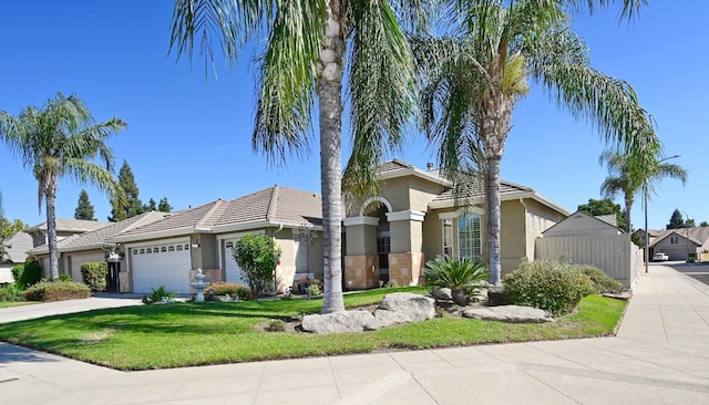 view of front of house with a front lawn and a garage