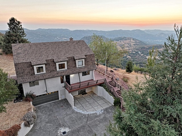 aerial view at dusk with a mountain view