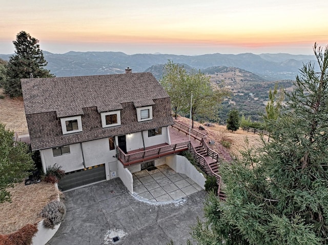 46149 Todd Eymann Rd, Miramonte, CA 93641 - exterior space with a shingled roof, a mountain view, stucco siding, and a garage