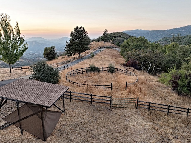 surrounding community featuring a rural view and a mountain view