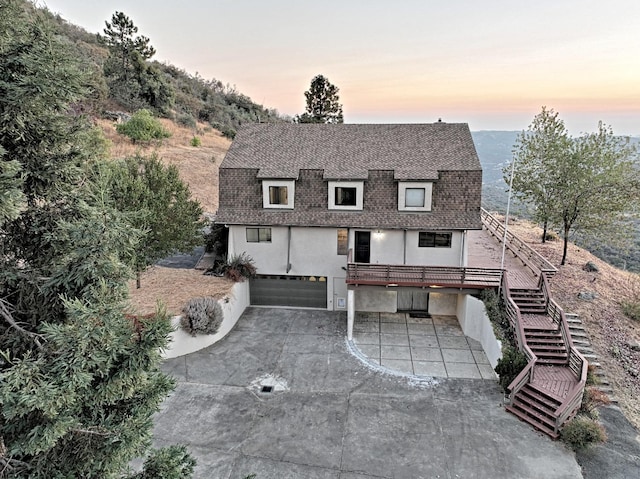 46149 Todd Eymann Rd, Miramonte, CA 93641 - exterior space featuring a garage, stairs, stucco siding, a shingled roof, and concrete driveway