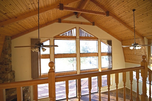 interior details featuring wood-type flooring, beamed ceiling, ceiling fan, and wooden ceiling