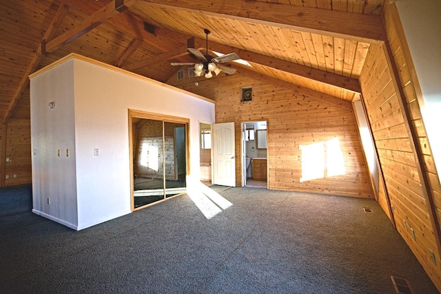 46149 Todd Eymann Rd, Miramonte, CA 93641 - carpeted empty room featuring wood walls, visible vents, wooden ceiling, beamed ceiling, and a ceiling fan