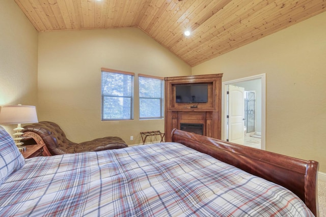 bedroom with ensuite bathroom, vaulted ceiling, and wooden ceiling